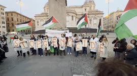 Israel-Hamas war: protesters form the slogan 'stop genocide' with some signs during the demonstration of solidarity with Dr. Hussam Abu Safiya of the health doctors for Gaza movement in Rome.