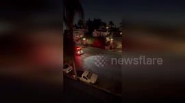 Firetrucks react to blaze spreading through Hollywood Hills