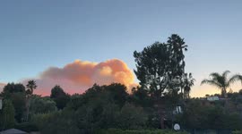 Helicopters dump water on Palisades Fire in Los Angeles