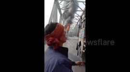 Fire engulfs bus full of passengers on bridge in India