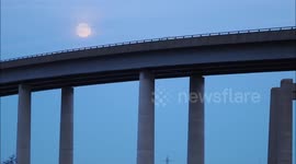 Stunning full Wolf Moon seen rising over Sheppey Crossing in Kent, UK