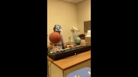 Playing Game Soundtrack On Piano While Spinning Basketball On Hand
