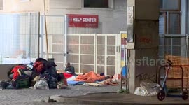 Two homeless men in makeshift shelters where they will spend a freezing January night outside the tensile structure of the Scalo di San Lorenzo installed by the Municipality to house the homeless on the occasion of the Jubilee in Rome.