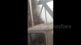 Passengers jump from windows as fire engulfs bus in India
