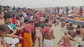 Worshippers bath in water at Maha Kumbh festival in India