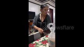 Doting mother delighted when her son returns from working abroad