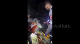 Civil defense teams managed to extract Palestinian bodies following massive airstrikes that targeted Gaza City
