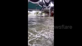 Waves batter funeral held next to sea in southern Thailand