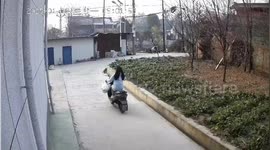 Woman on scooter crashes into house after smashing through iron door