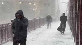 Heavy snow and biting winds hit Chicago as temperatures plunge