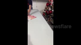 Family plays candle-blowing game to win money