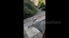 Porsche crashes through wall outside building in China