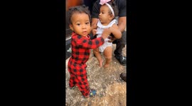 Toddler's first meeting with baby cousin takes an unexpectedly comical turn