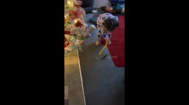 Little girl pushes bauble with stick and it mysteriously vanishes into thin air