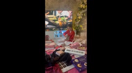 Tween girl screams with joy after unwrapping her skincare Christmas presents