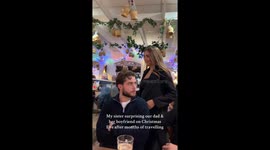Girl returns from travel and surprises dad and boyfriend with a Christmas hug