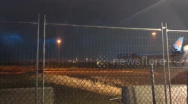 Jetstar plane waits on taxiway for storm to pass in Sydney