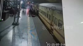 Railway Police force saved  two passengers who fell down into the gap of platform edge and  running train in Asansol, Northern India