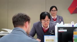 Foreign expats in China's Guangdong receive 1st batch of integrated work-social security cards