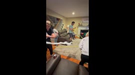 Christmas festivities peak as everyone competes to unwrap crepe paper in fun game