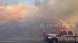 Firemen bring vegetation blaze under control in San Bernardino, California