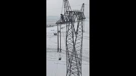 Robots repair wires in freezing weather in NE China