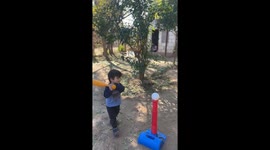 Exclusive- Sibling baseball mishap: A swing and a... whoops!