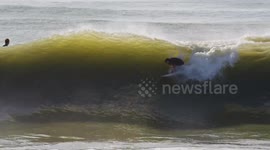 Surfer Wipeout Flips Backward