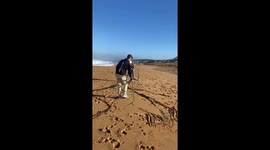Man Hilariously Runs From Oncoming Wave