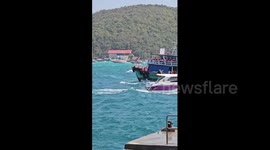 Strong waves batter boats taking tourists to Thai island
