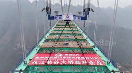 China completes main structure of world's tallest bridge