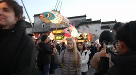 Int'l students experience traditional culture in E China village