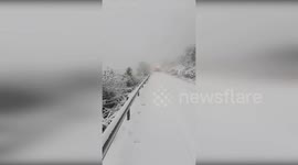 Spain: Firefighters Battling Rain and Snowstorm to Clear Roads in Valencia