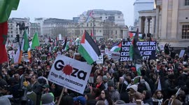 Pro-Palestine protesters gather in Trafalgar Square after the end of the rally in Whitehall, London, UK
