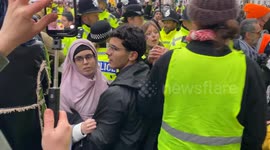 Protesters breach a police line while taking part in a National March for Palestine on Whitehall in central London