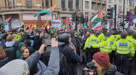 Pro-Palestine demonstrators break through a Police lines and head towards the BBC after fiery scenes in Westminster boil over