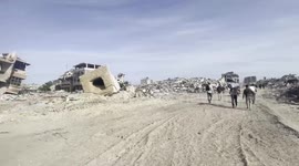 Fighters of Ezz al-Din Al-Qassam brigades patrol streets of Deir al-Balah