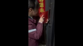 Chinese girl unlocks door with cardboard