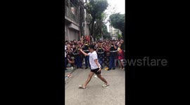 Youngster performs epic majorette dance at street fiesta