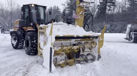Snowblower tractor clears roads amid severe snow in New York