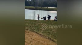 Brave parkgoer swims into lake to save child from floating human hamster ball