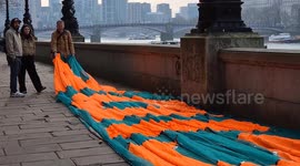 Activists Unfurl Bold Banner Condemning Climate Policies on Day of Trump’s Inauguration