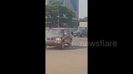 Car engine catches fire sparking panic on road in Cameroon