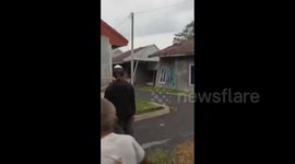 Landslide swallows row of homes amid heavy rain in Indonesia