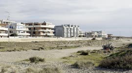 Some of the residential buildings that overlook a stretch of coast in the area where Royal Caribbean plans to build Italy’s first large privately-run marina in Fiumicino, near Rome.