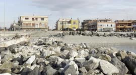 Some of the residential buildings that overlook a stretch of coast in the area where Royal Caribbean plans to build Italy’s first large privately-run marina in Fiumicino, near Rome.