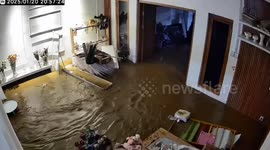 Floods surge through home amid heavy rain in Indonesia
