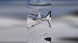Helicopter rescues skiers injured from chair lift collapse in Spain