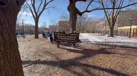 Protesters walk through Lafayette Square in demonstration against Trump