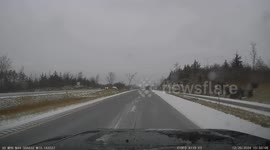 Car Slides Off Icy Road and Rolls Over